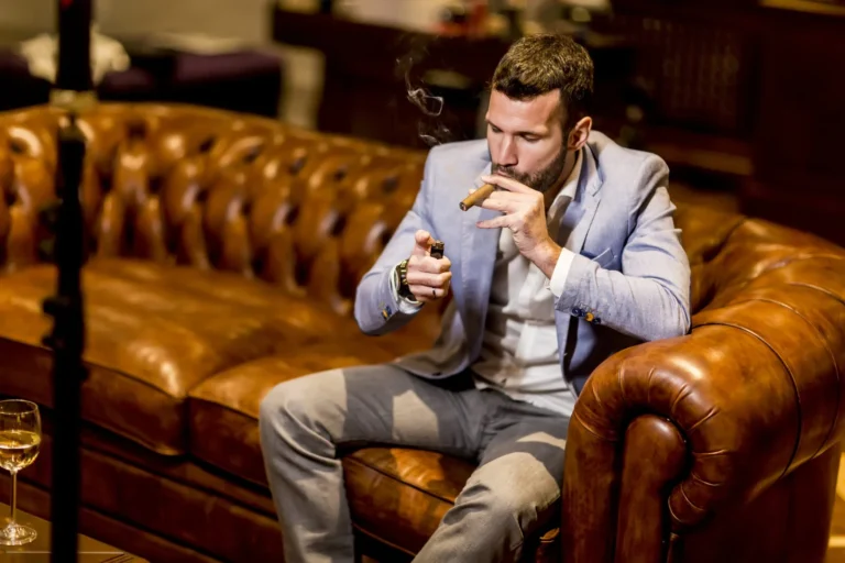 A man smoking a selection of premium limited-edition 2026 anniversary cigars